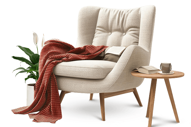 Styled reading chair with a blanket, books, plant, and side table